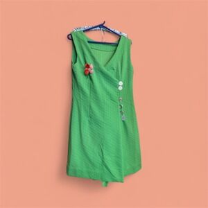 Vibrant Green Sleeveless Mini Dress with Button Detail